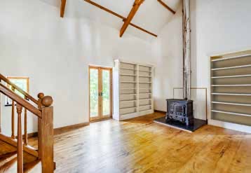 A woodburning stove beneath the mezzanine in the Winter Study.