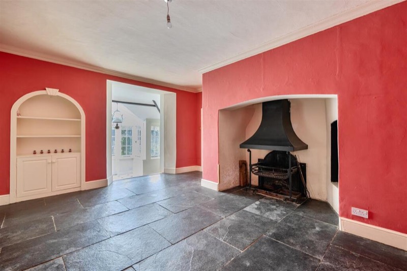 The dining room looking through an arched alcove towards the morning room.