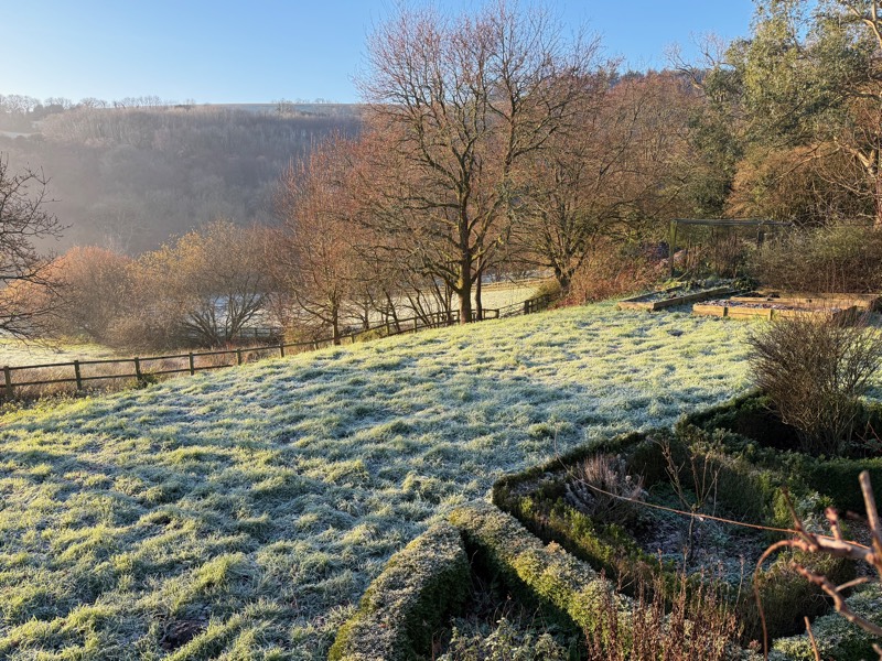 Hard frost across the garden and valley on a clear December morning.