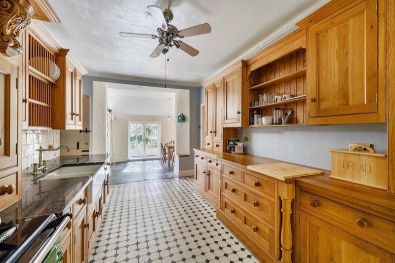 Bespoke oak drawers and a dresser along the length of the kitchen.
