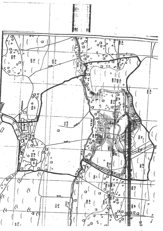 A historic Ordnance Survey map sheet showing field boundaries, woodland symbols, a stream and a railway line, with numbered parcels and their acreages, and the estate perimeter marked in a heavy line.