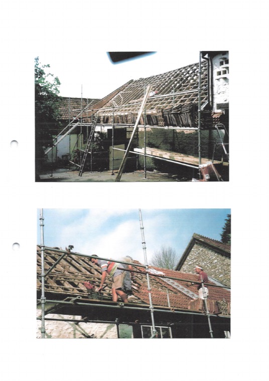 Scanned album page showing the barn roof under scaffolding with tiles partly stripped.